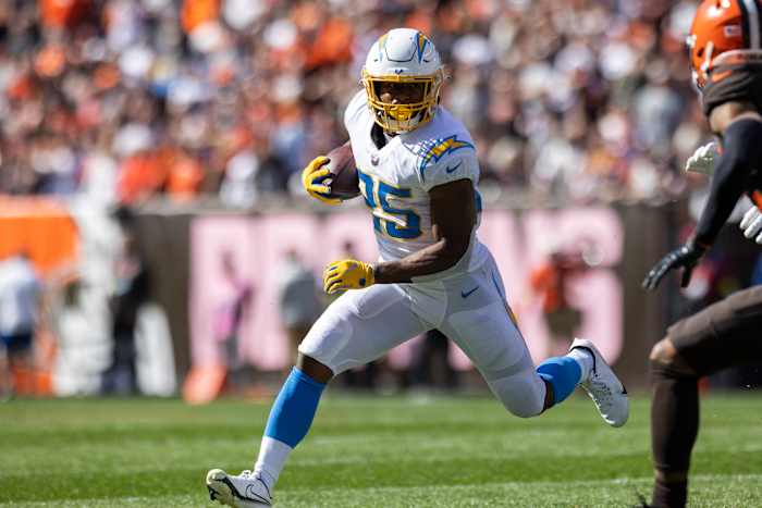 Oct 9, 2022; Cleveland, Ohio, USA; Los Angeles Chargers running back Joshua Kelley (25) runs the ball against the Cleveland Browns during the second quarter at FirstEnergy Stadium. Mandatory Credit: Scott Galvin-USA TODAY Sports